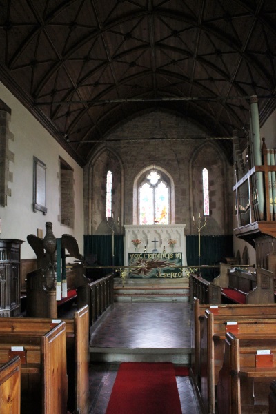 The aisle with pews either side and looking towards the altar