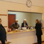 Four women standing in the hall