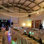 Millennium Hall set out with tables and chairs for a wedding