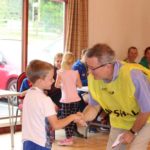 Man and child shaking hands