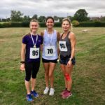 Three people in running gear