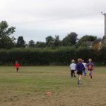 Children running in a field