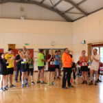 Hall full of people in running gear