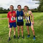 Three men in running gear