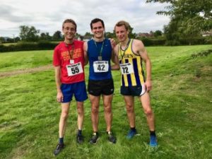 Three men in running gear