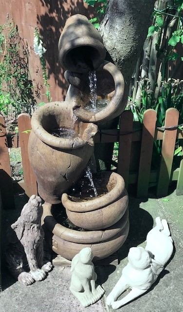 A water feature with cascading pots