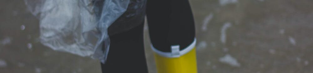 Person in yellow wellies wading through water