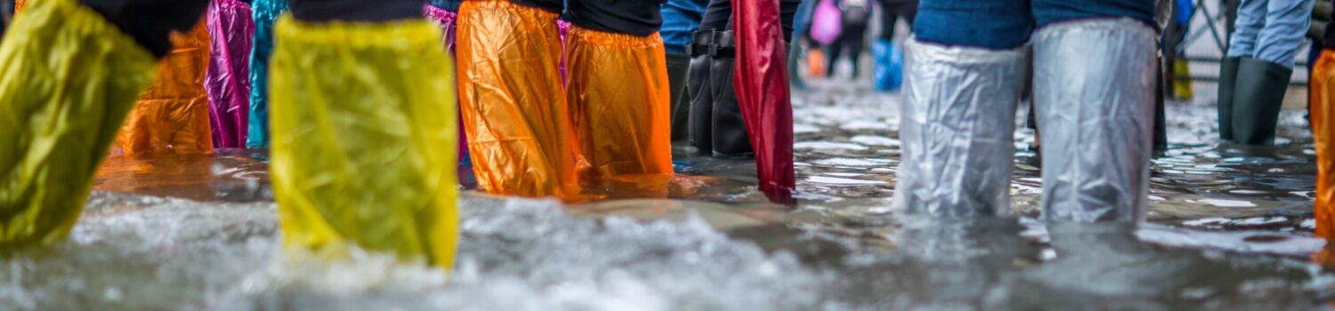 People wading through water