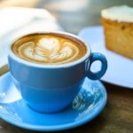 Blue cup and saucer with brown liquid