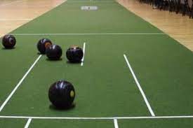 black bowls on a green mat