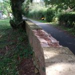 Stone wall with missing coping stones