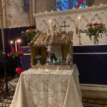 Christmas flowers and candles in the church