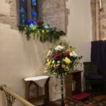 Christmas flowers and candles in the church