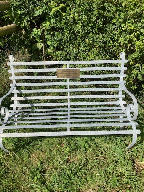 metal bench in the community orchard