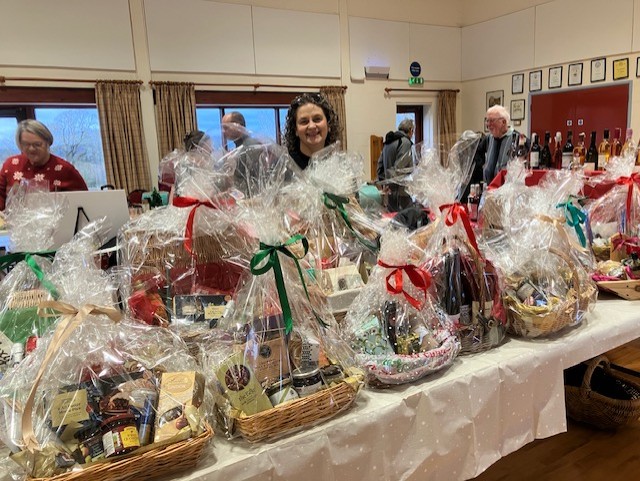 Wicker hampers filled with Christmas goodies and covered in cellophane